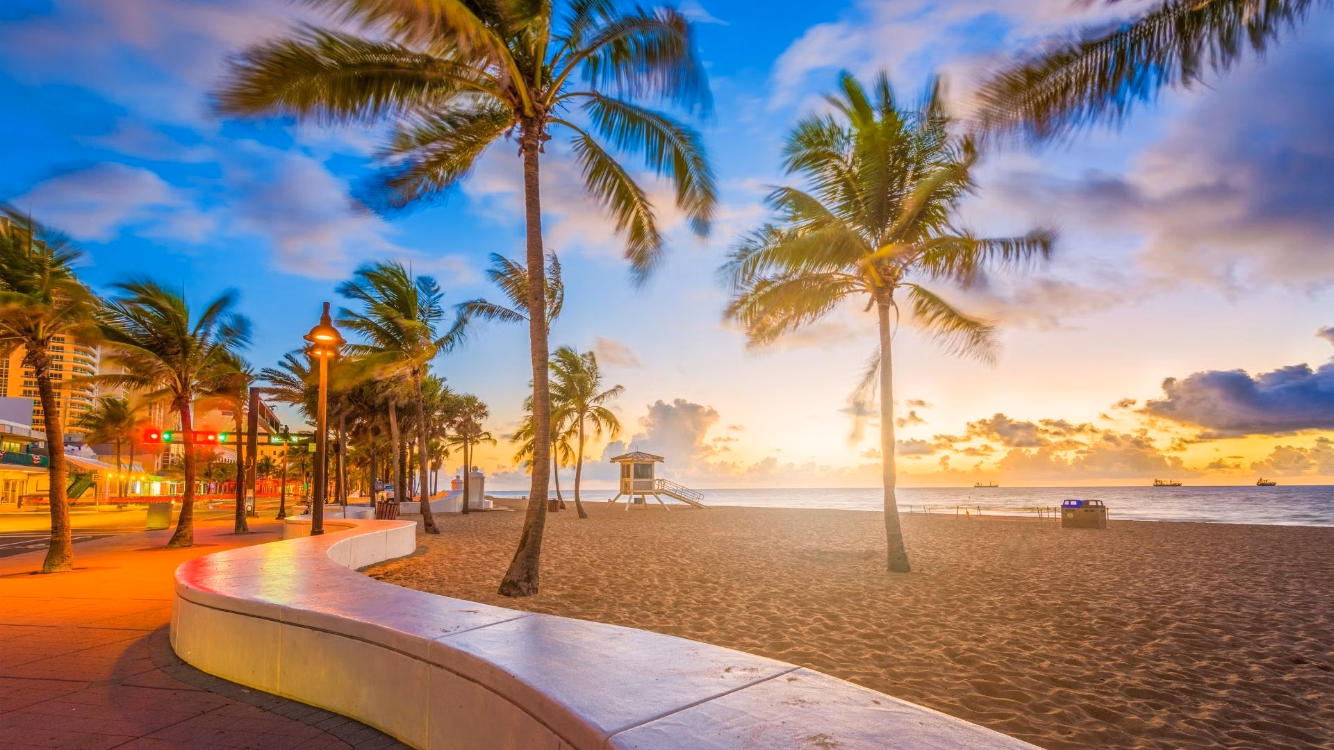 Palms and the shoreline at Fort Lauderdale beach at sunrise